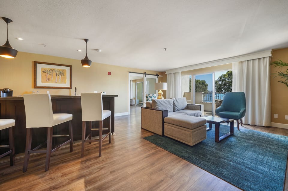 Kona Kai One Bedroom Suite | Living area | 42-inch flat-screen TV with digital channels, TV, iPod dock