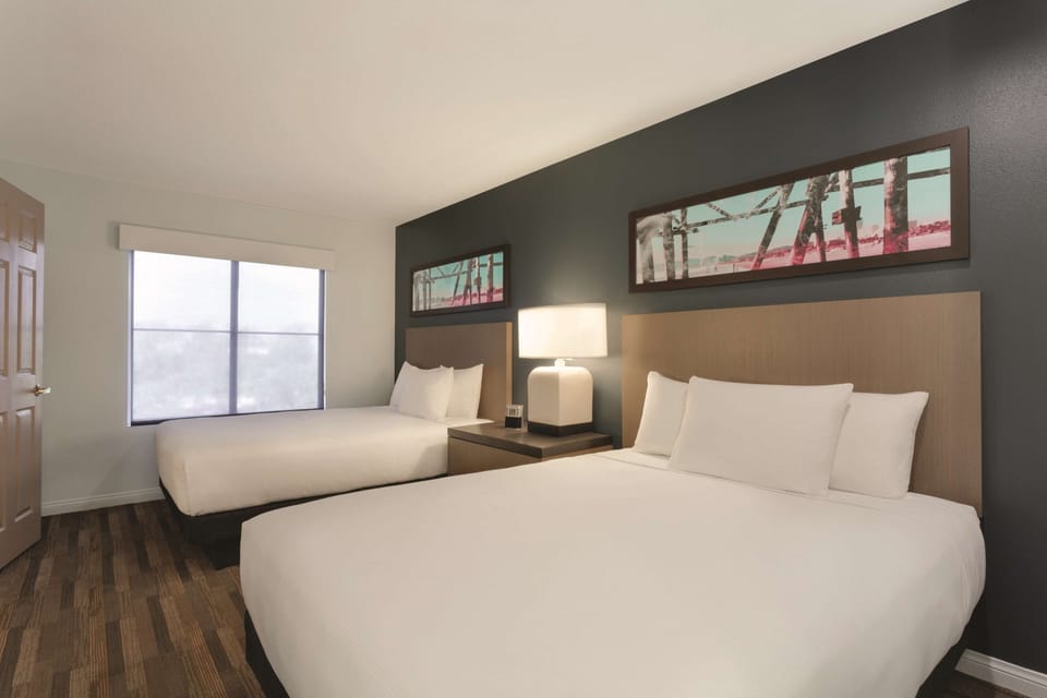 Suite, 2 Queen Beds | Down comforters, desk, blackout drapes, iron/ironing board