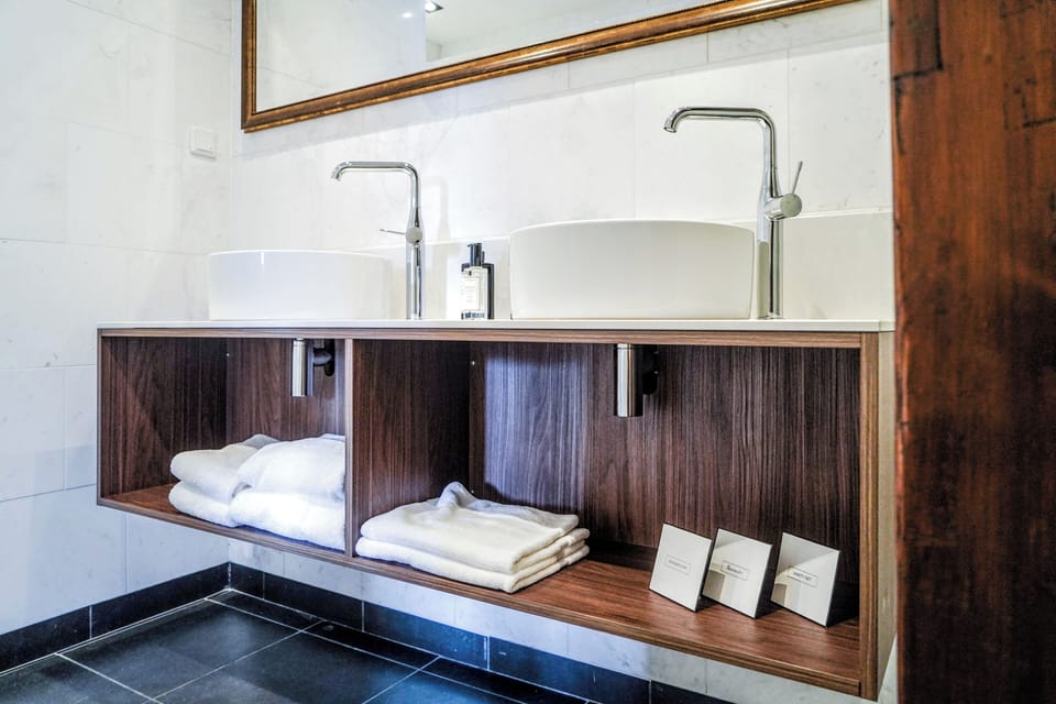 Executive Suite | Bathroom | Designer toiletries, hair dryer, bathrobes, slippers