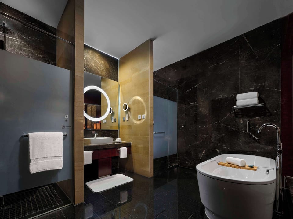 Separate tub and shower, deep soaking tub, rainfall showerhead