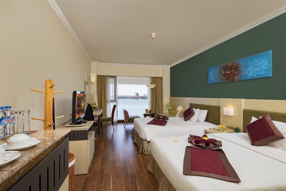 Deluxe Double Room, River View | Minibar, desk, blackout drapes, free WiFi