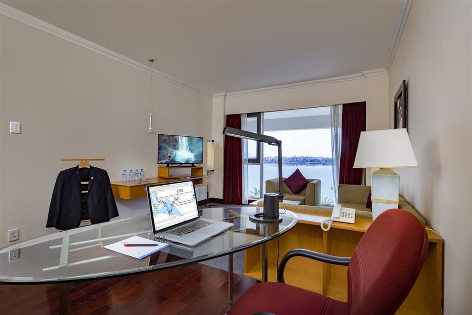 Executive Suite, 1 Double Bed, City View | Living area | LCD TV