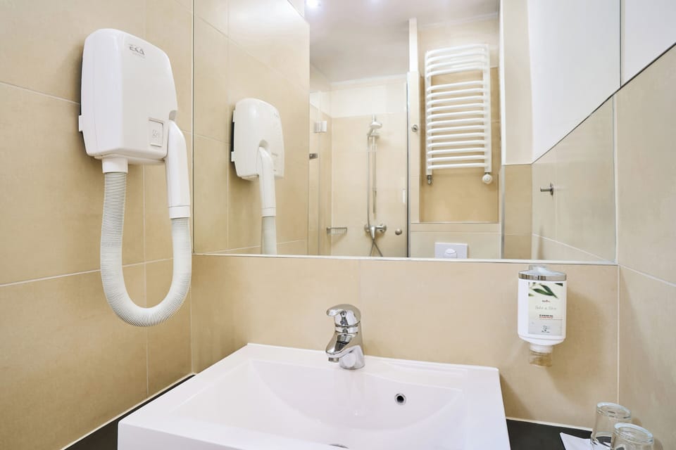 Shower, free toiletries, hair dryer, towels