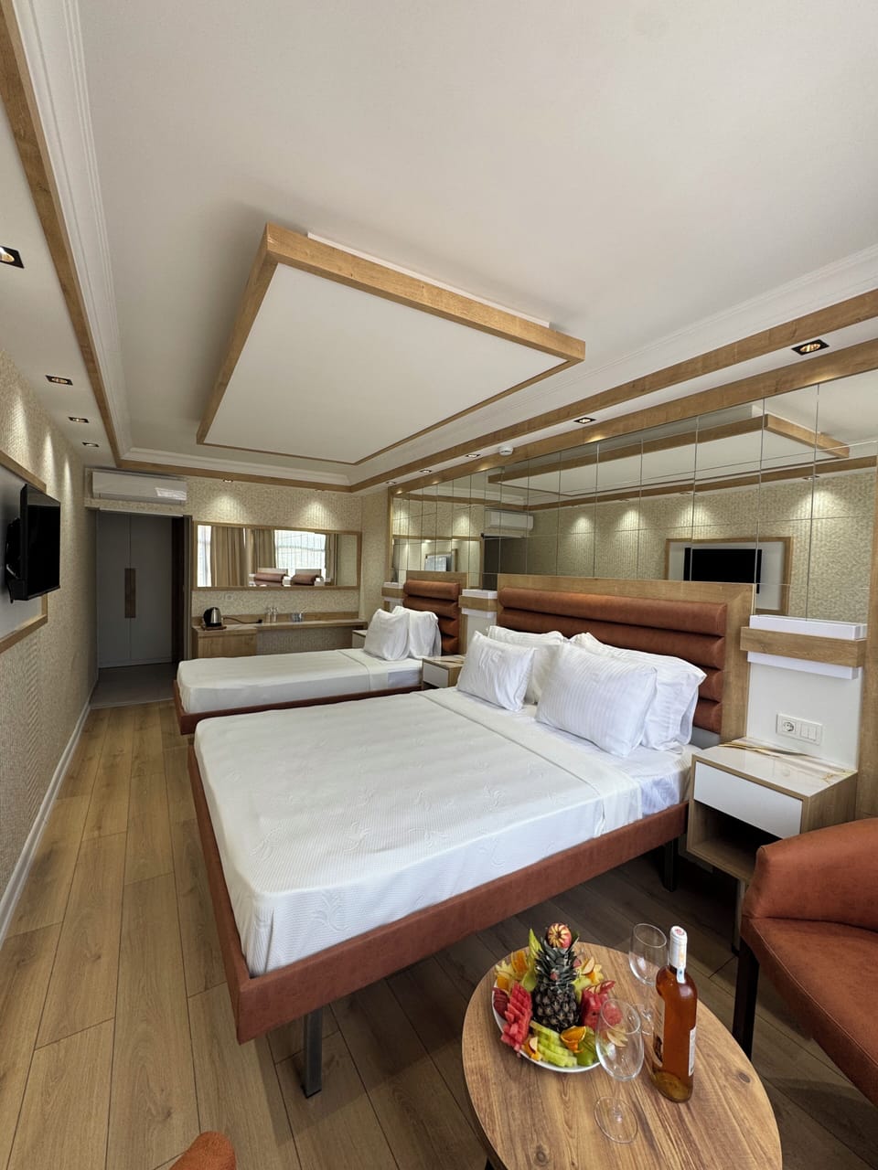 Triple Room | Minibar, in-room safe, desk, iron/ironing board