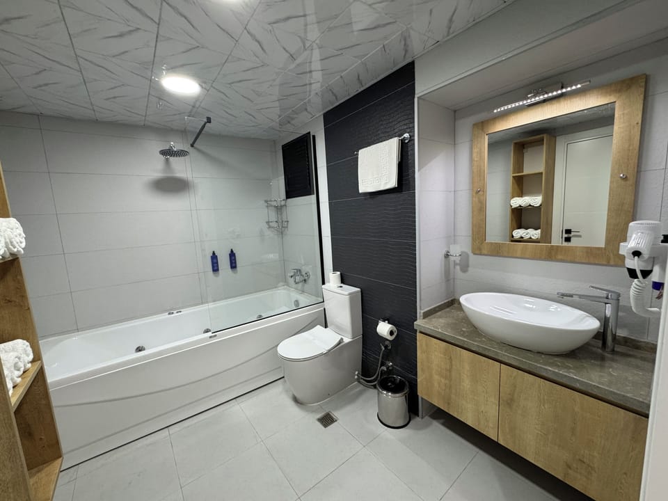 Double Room | Bathroom | Shower, hair dryer, slippers, towels