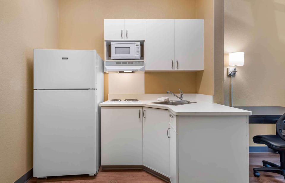 Studio, 1 Queen Bed, Non Smoking | Private kitchen | Full-size fridge, microwave, stovetop, coffee/tea maker