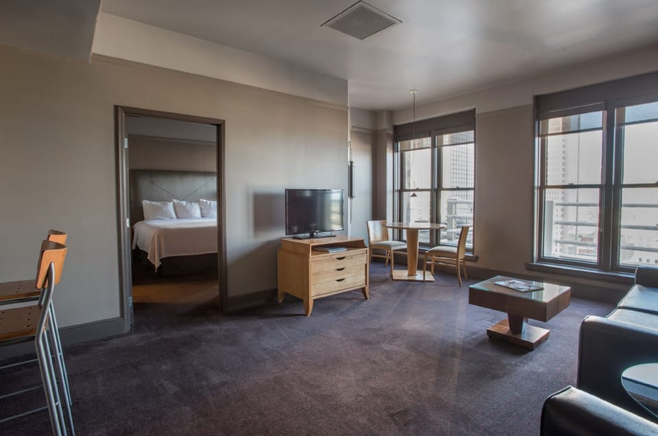 Signature King Suite | Living area | 40-inch LCD TV with satellite channels, TV