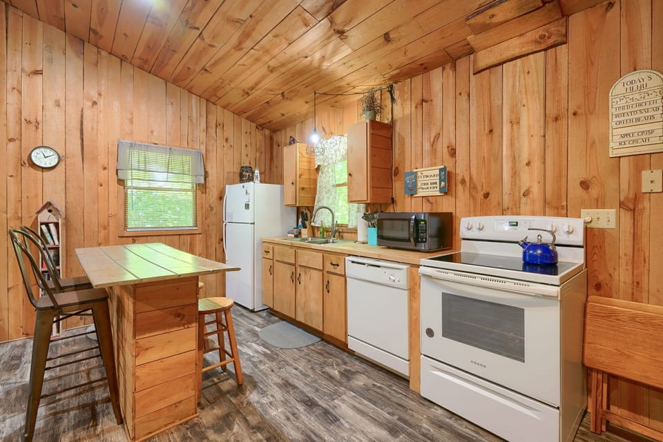 Full kitchen with dishwasher, full size fridge and stove