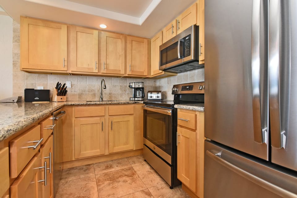 New appliances large and small and cupboards full of gadgets & spices
