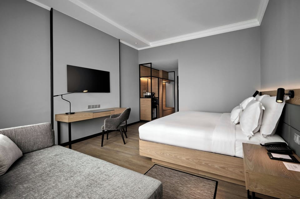 Deluxe Room, 1 King Bed with Sofa bed | In-room safe, desk, blackout drapes, soundproofing