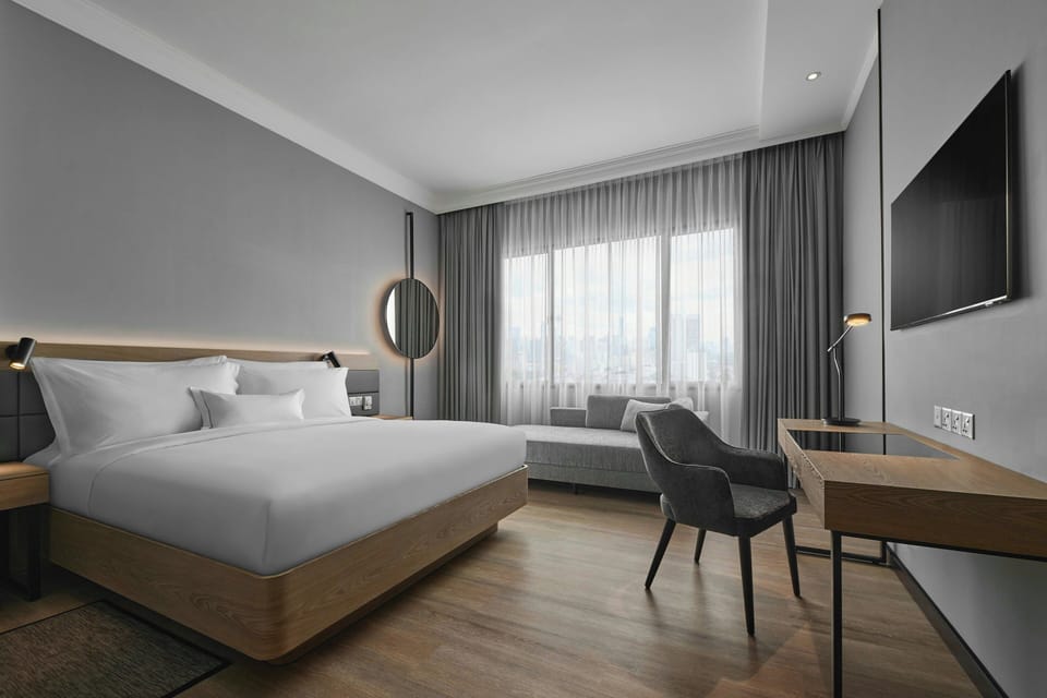 Premium Room, 1 King Bed with Sofa bed | In-room safe, desk, blackout drapes, soundproofing