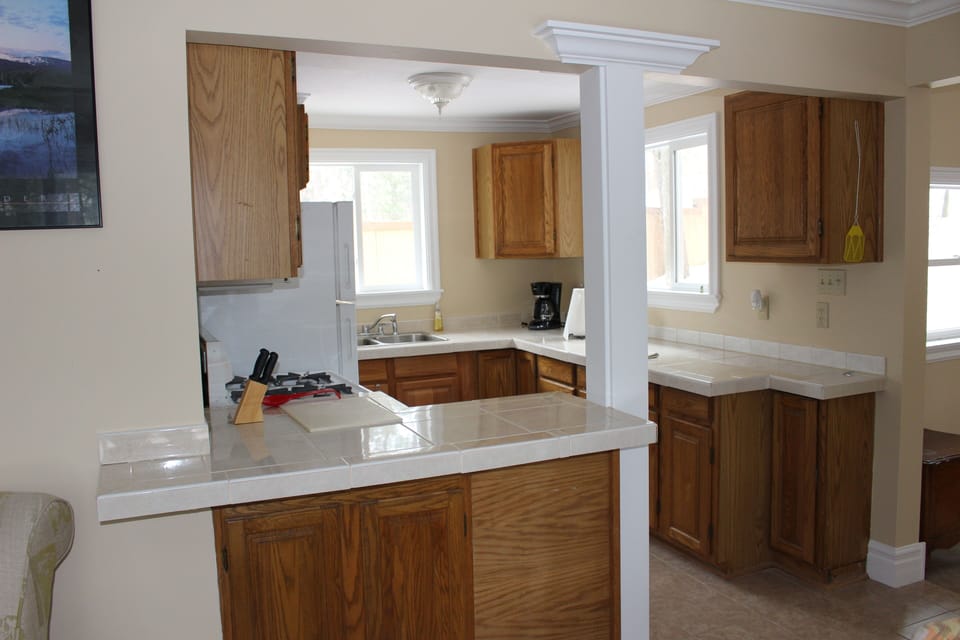 Kitchen has a breakfast bar that seats two.