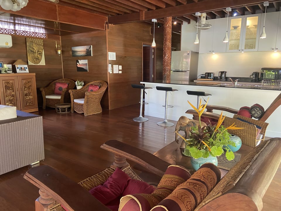 Modern kitchen and spacious living area with aircon