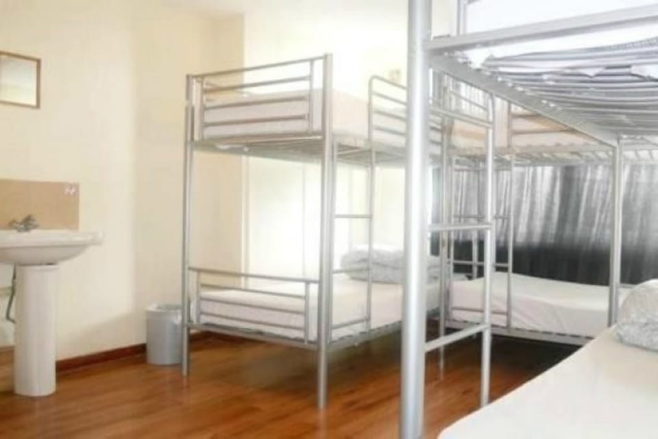Basic Quadruple Room, Shared Bathroom | In-room safe, iron/ironing board, WiFi