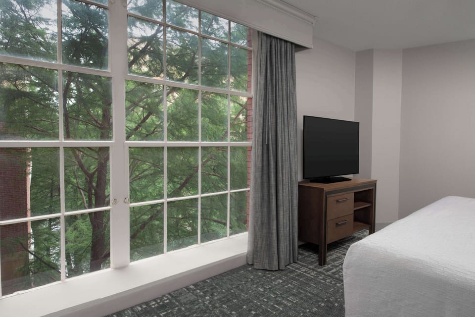Suite, 2 Bedrooms | Desk, laptop workspace, blackout drapes, iron/ironing board
