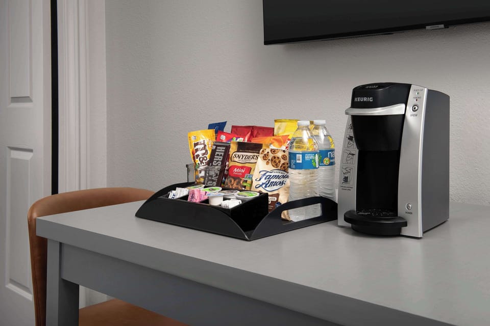Desk, laptop workspace, blackout drapes, iron/ironing board