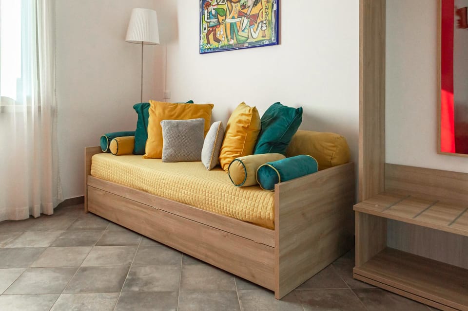 Panoramic Quadruple Room, Balcony, Sea View | Minibar, in-room safe, desk, blackout drapes