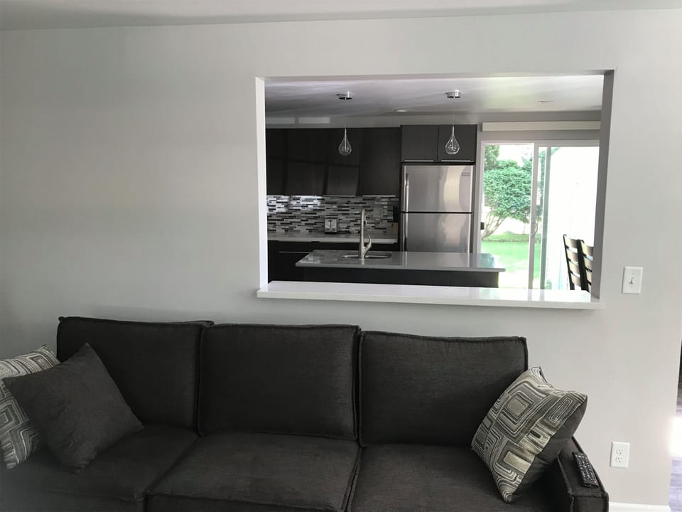 Pass through from kitchen to living room allows for open feel.