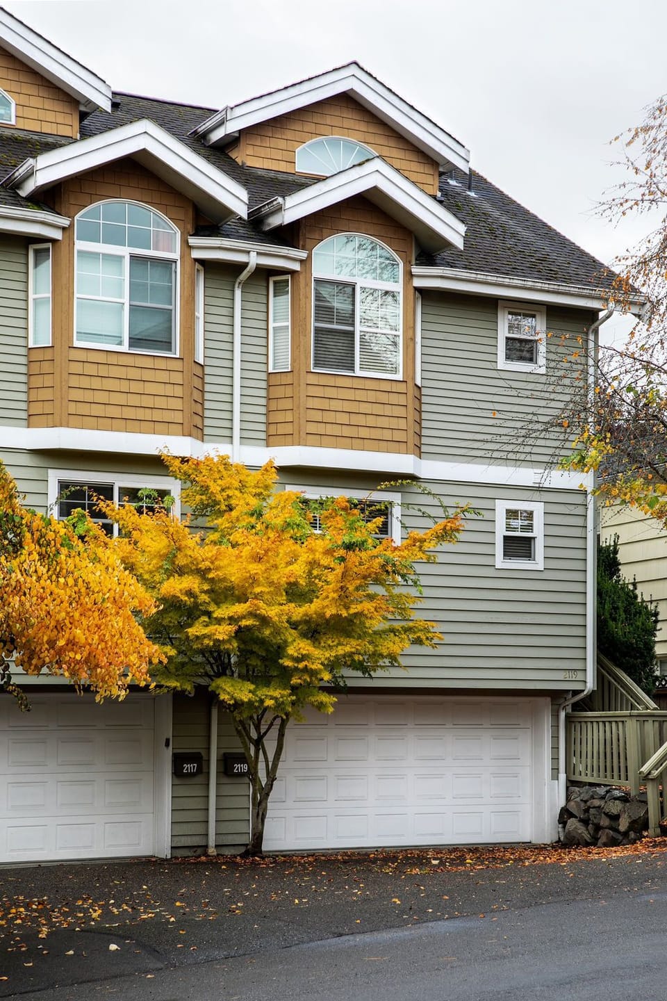 House is on the right.  Garage fits one car and the driveway fits one car.