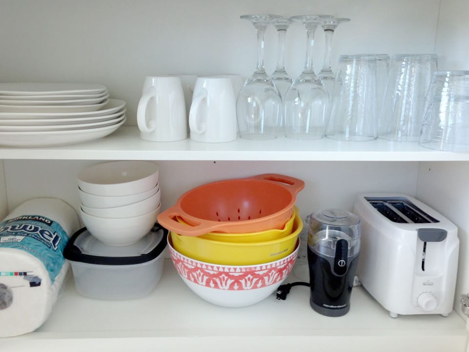 Comes with kitchenware, coffee pot and grinder, microwave, induction hotplate, toaster, full size refrigerator, and more.