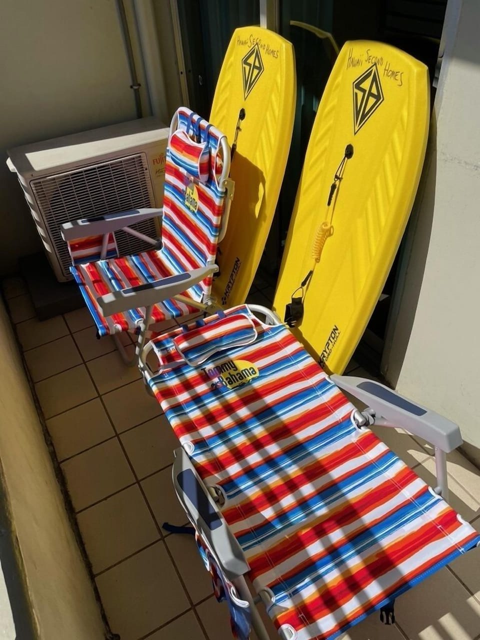 Save time and money with the Tommy Bahama backpack beach chairs, two boogie boards, a beach cooler and a beach umbrella provided for you.