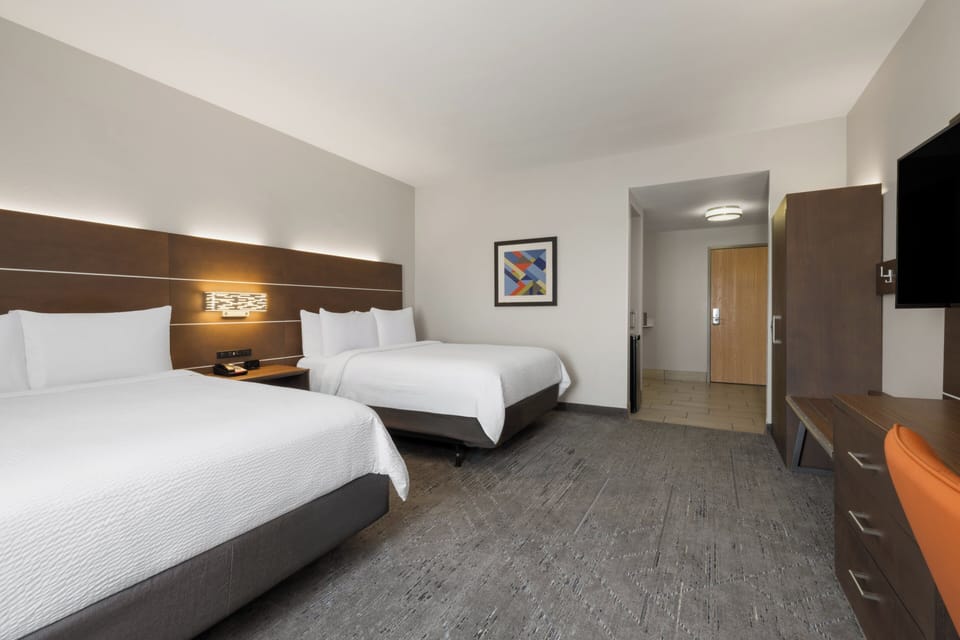 In-room safe, desk, iron/ironing board, cribs (free)