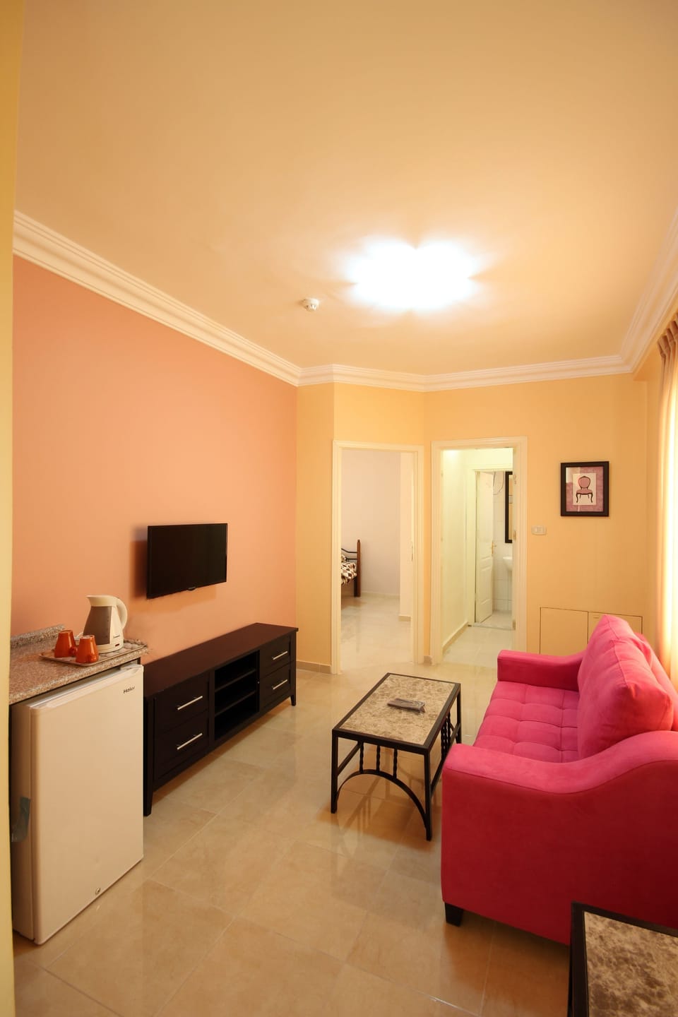 Deluxe Apartment, 1 Bedroom | Living area | 32-inch flat-screen TV with satellite channels, TV