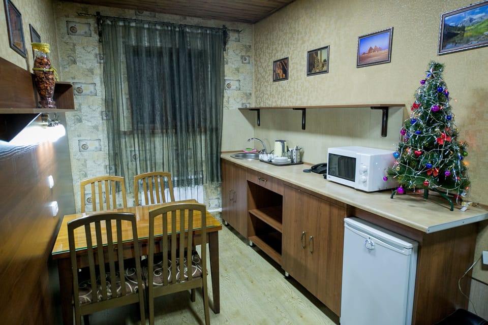 Family Apartment, 2 Bedrooms | Living area | 32-inch flat-screen TV with digital channels