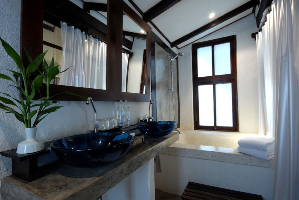 Superior Room | Bathroom | Rainfall showerhead, hair dryer, bathrobes, slippers