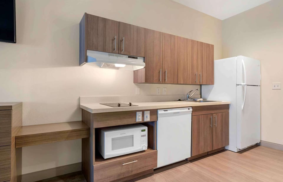 Studio, 2 Queen Beds, Non Smoking | Private kitchen | Full-size fridge, microwave, stovetop, cookware/dishes/utensils