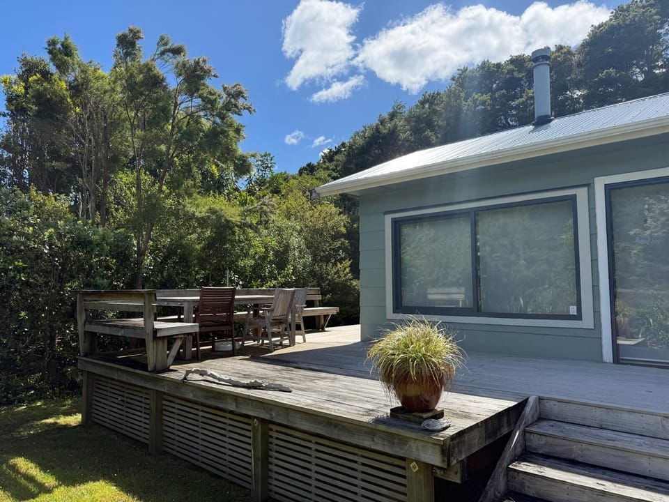 Front deck with outside table and umbrella available.