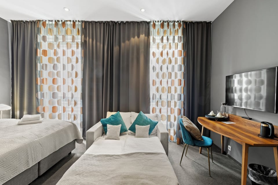 Deluxe Room | Individually decorated, desk, laptop workspace, blackout drapes