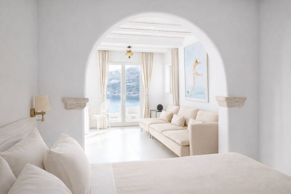 Junior Suite, Sea View | Premium bedding, minibar, in-room safe, individually decorated