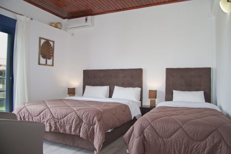 Superior Triple Room, Balcony, City View | In-room safe, blackout drapes, free WiFi, bed sheets
