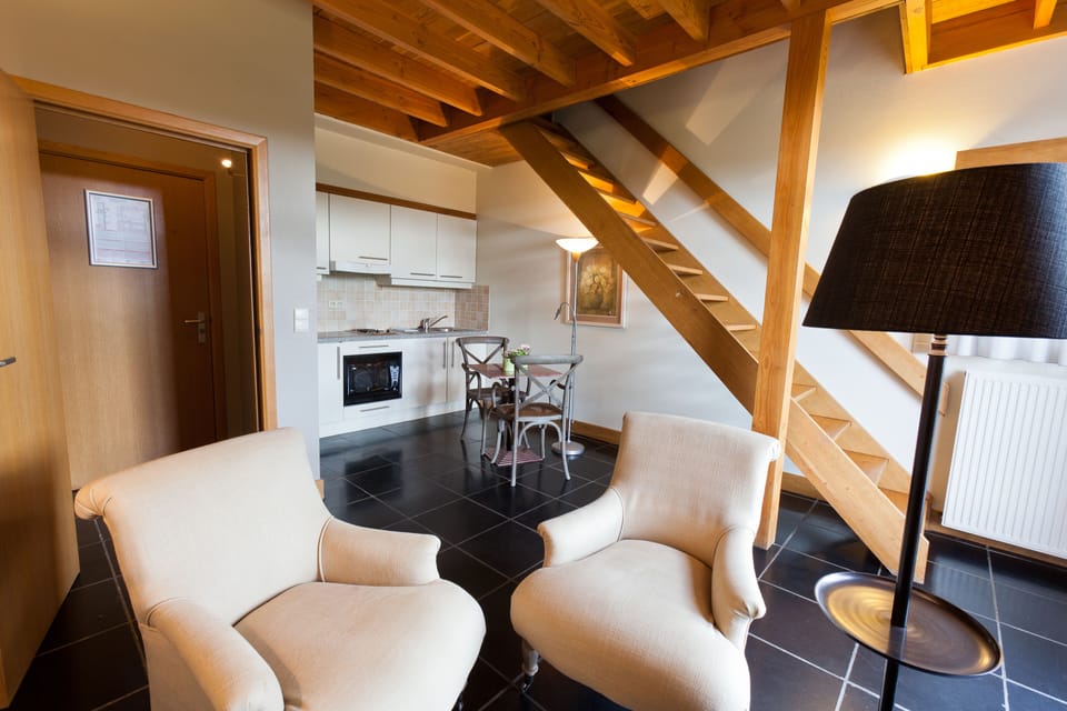 Luxury Suite | Living area | Flat-screen TV