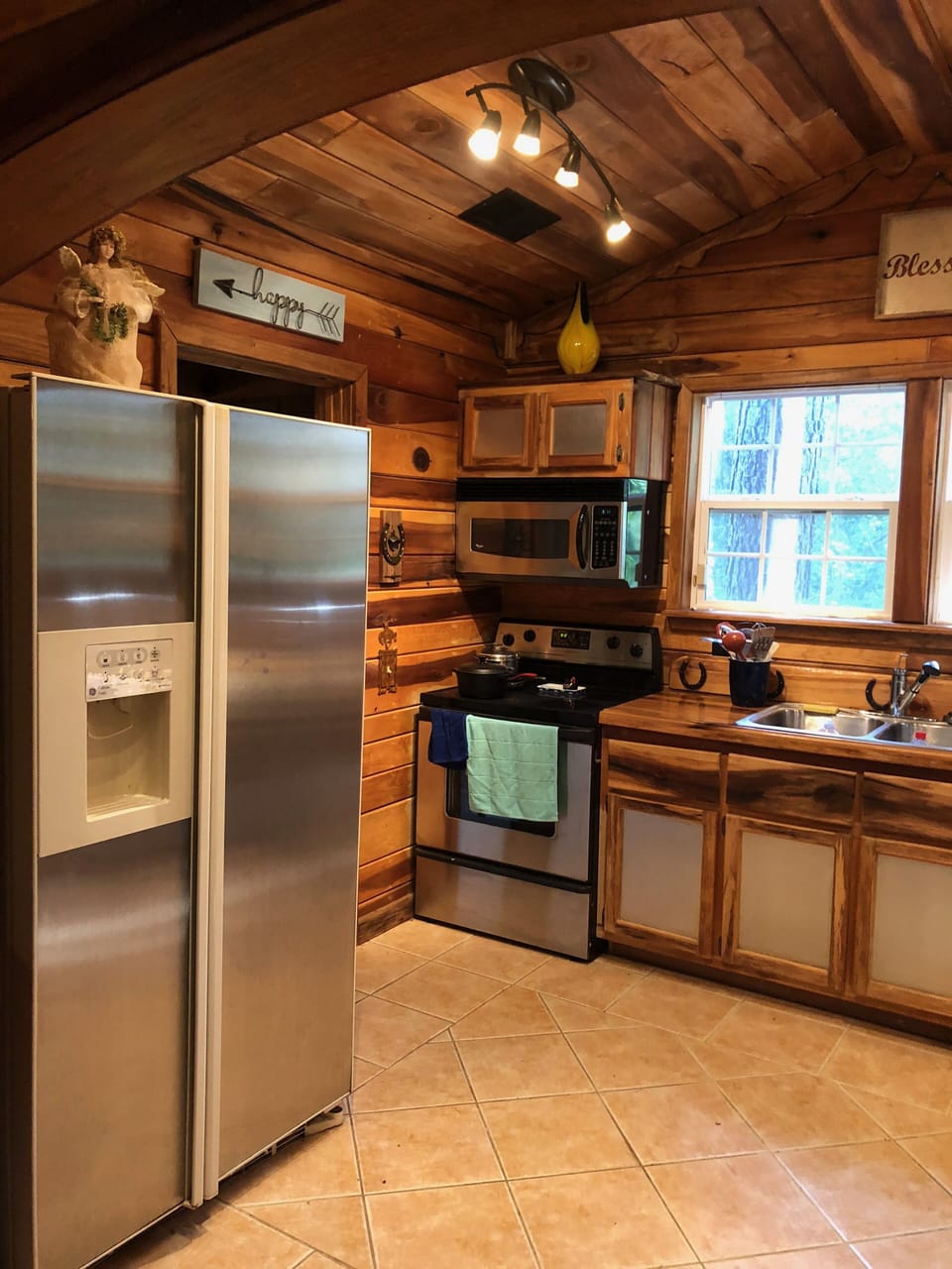 The kitchen has a full sized fridge, stove, and microwave.  All is electric.