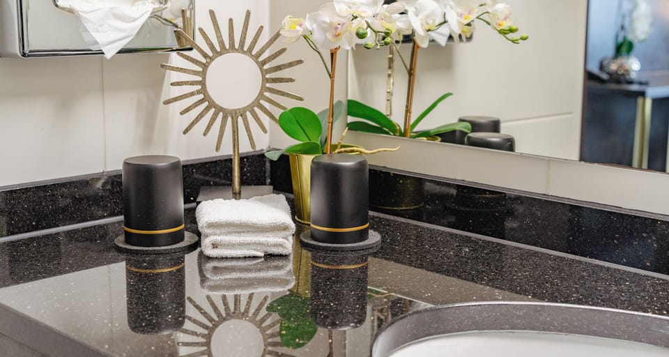 Shower, rainfall showerhead, hair dryer, towels
