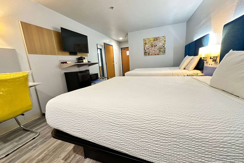 Standard Room, 2 Queen Beds | In-room safe, desk, soundproofing, cribs (free)