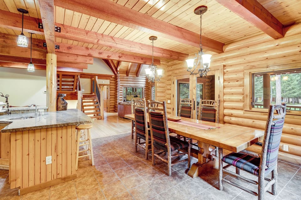 Formal dining with flexibility—extra table & chairs for full-group meals.