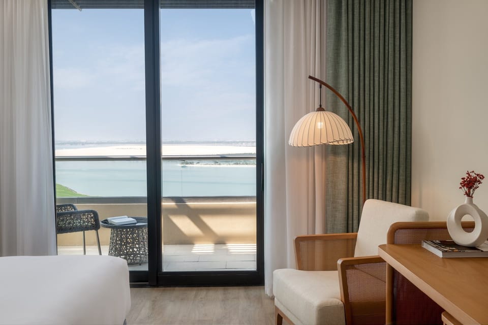 1 King Deluxe Sea View Balcony Theme Park Access | Premium bedding, minibar, in-room safe, individually decorated