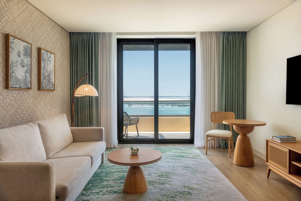 1 Bedroom Suite Sea View Balcony Theme Park Access | Living area | Flat-screen TV, iPod dock