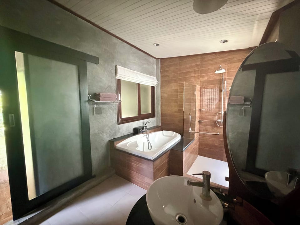 Deluxe Triple Room, Terrace, Garden View | Bathroom | Separate tub and shower, rainfall showerhead, free toiletries
