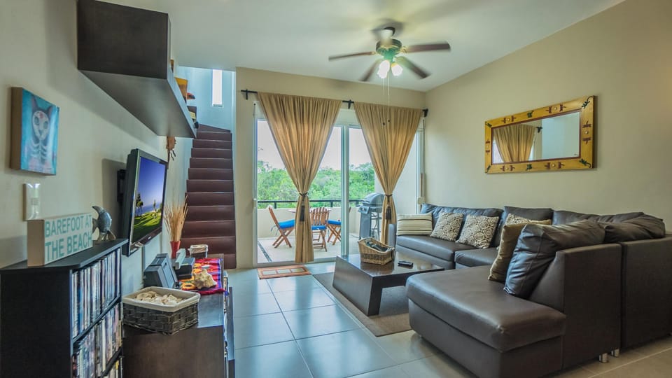 Living room, balcony, stairs to private rooftop