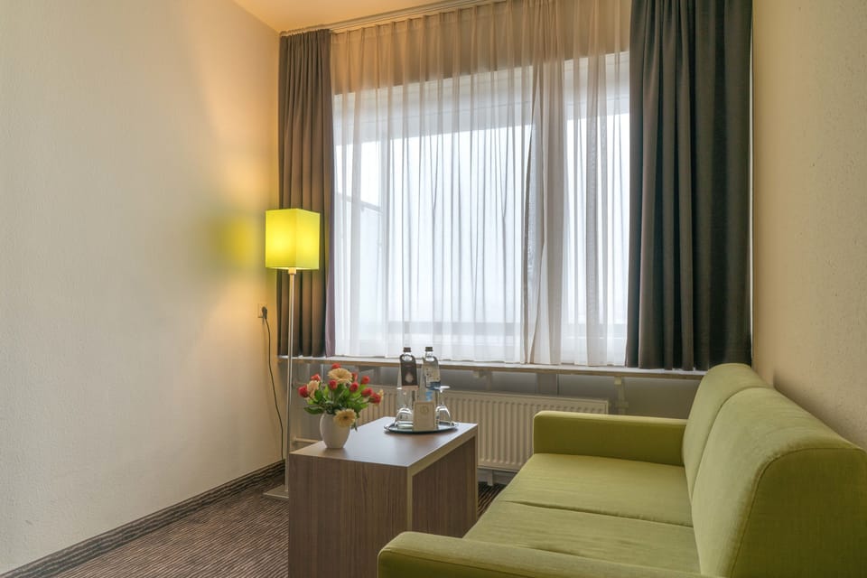 Comfort Double Room, Balcony | Living area | Flat-screen TV