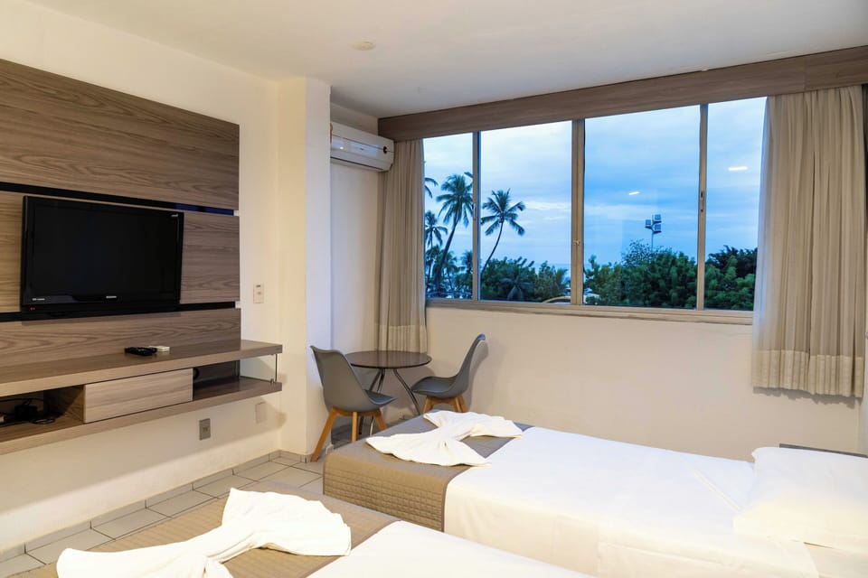 Double or Twin Room, Sea View | Minibar, in-room safe, free WiFi, bed sheets