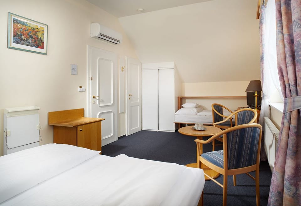 Comfort Quadruple Room, 1 Bedroom, City View | Blackout drapes, soundproofing, free WiFi