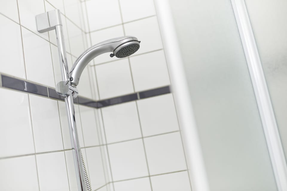 Bathtub, hair dryer, towels