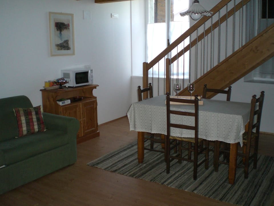 Standard Duplex, 1 Bedroom | Living room | Flat-screen TV