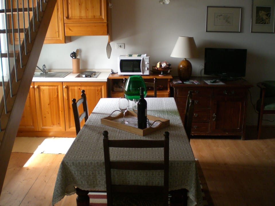 Standard Duplex, 1 Bedroom | Living area | Flat-screen TV