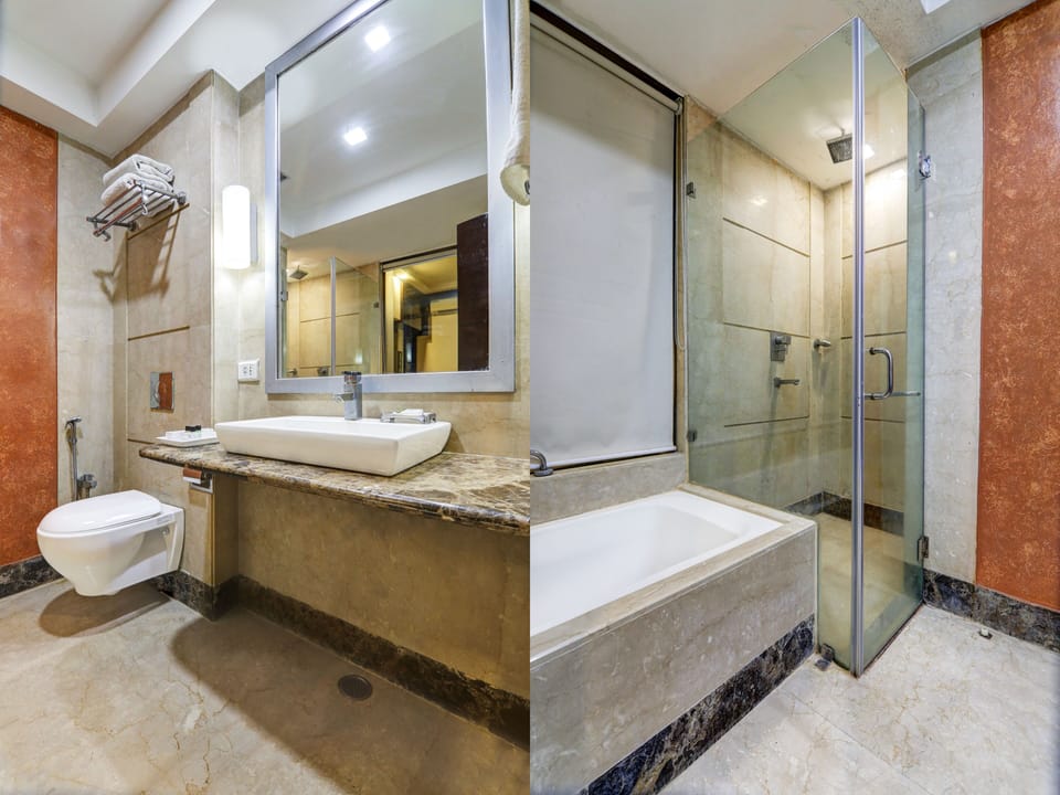 Luxury Double Room, 1 King Bed | Bathroom | Rainfall showerhead, designer toiletries, hair dryer, slippers